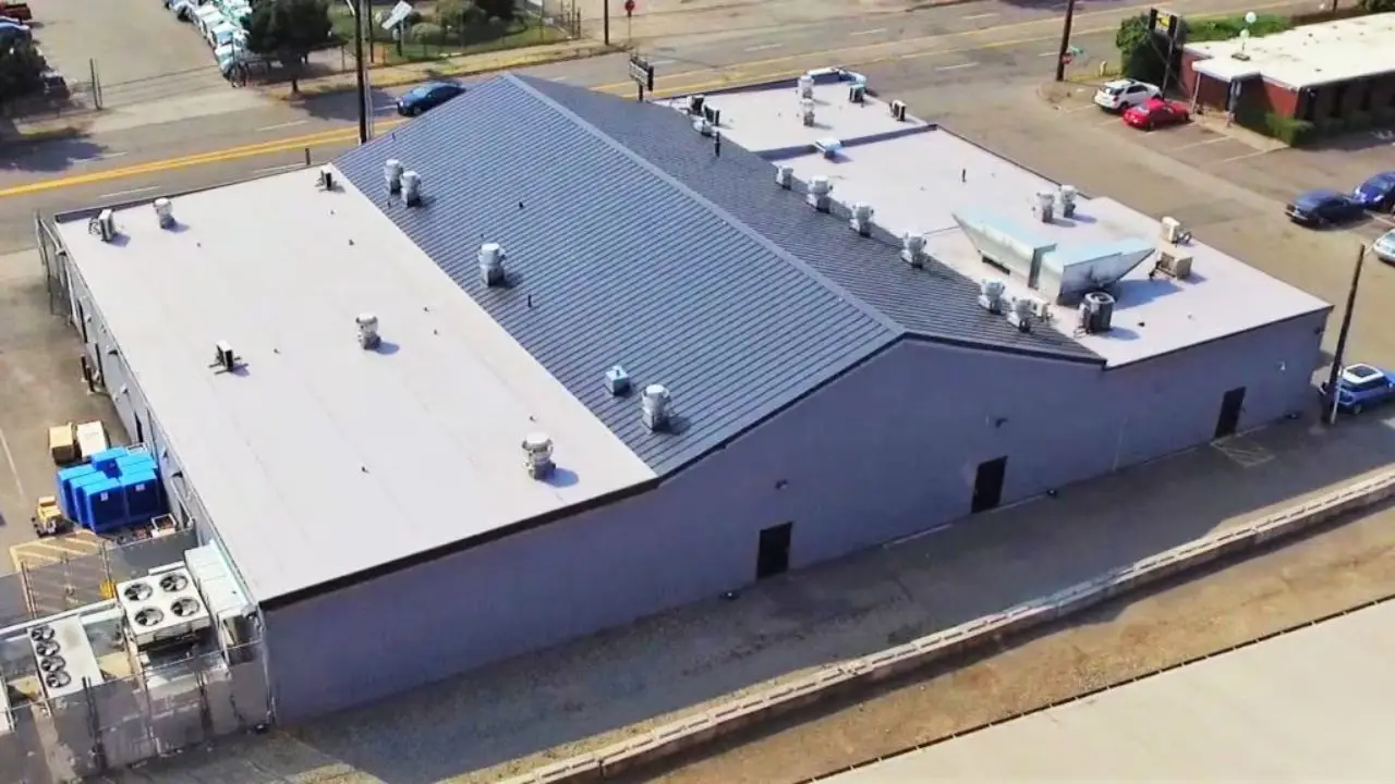 What is the process of replacing a flat roof?